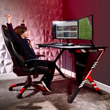 x rocker gaming desk with red and blue stickers