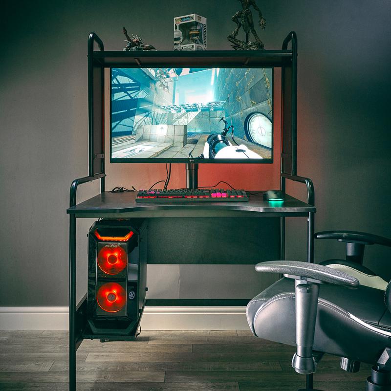black gaming desk with gamer computer and LED hard drive and keyboard and mouse